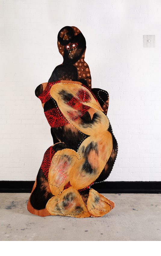 Sitting, oil and acrylic on plywood, 170.18 cm x 86.36 cm, 2009, and Leg Up, oil and acrylic on plywood, 221 cm  x 81.28 cm, 2008. Image credit: Thierry Bal
