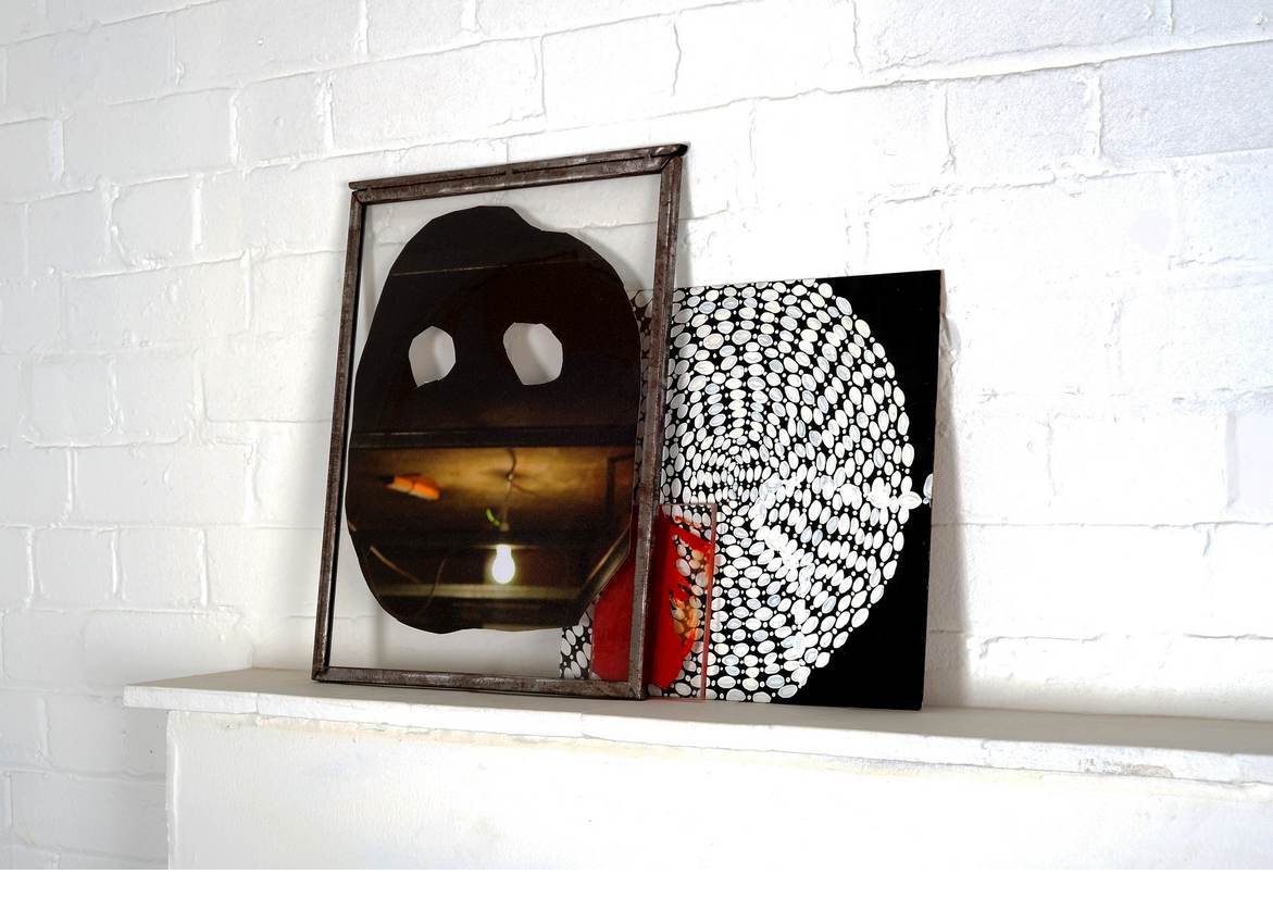 Mask, acrylic on digital print on canvas in a metal frame, 42 cm x 29 cm, 2009, Circle necklace, acrylic on MDF, 30 cm x 30 cm, 2009, and red palette, 12 cm x 9 cm, 2008. Image credit: Thierry Bal